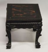 A SMALL CHINESE SQUARE FORM HARDWOOD TABLE, with carved floral frieze, supported on four curving