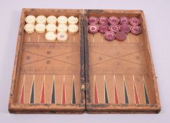 A SET OF TWELVE WHITE AND FOURTEEN RED STAINED IVORY DRAUGHT PIECES, 3cm diameter, in a leather