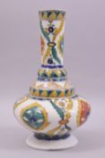 A TURKISH KUTAHYA GLAZED POTTERY VASE, the vase painted with various stylised floral motifs, 26.