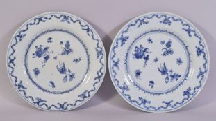 A PAIR OF CHINESE BLUE AND WHITE PORCELAIN PLATES, painted with flowers and butterfly, 23cm