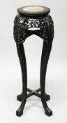 A CHINESE HARDWOOD AND MARBLE INSET CIRCULAR VASE STAND, with pierced and carved frieze and