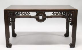 A VERY GOOD CHINESE RECTANGULAR LOW TABLE, POSSIBLY HUANGHUALI, with well carved pierced frieze,