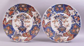 A GOOD LARGE PAIR OF JAPANESE CIRCULAR IMARI CHARGERS, each decorated to the centre with a prunus in