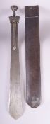 AN IMPRESSIVE EARLY INDIAN PATISSA SWORD and leather scabbard, the heavy steel blade mounded with