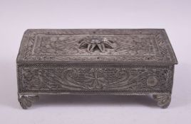 AN OTTOMAN ALBANIAN FILIGREE WHITE METAL BOX, with hinged lid and raised on four filigree metal