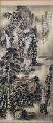 A CHINESE SCROLL PAINTING OF BUILDINGS AT THE BASE OF A MOUNTAINOUS LANDSCAPE, script and seal marks