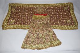 TWO LARGE INDIAN EMBROIDERED TEXTILES, consisting of a skirt and shawl, lavishly adorned with