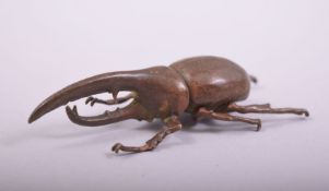 A JAPANESE BRONZE MODEL BEETLE, mark to underside, 7.5cm long.