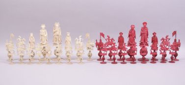 A VERY GOOD 19TH CENTURY CHINESE CARVED AND STAINED IVORY CHESS SET, each piece standing on a