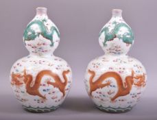A GOOD PAIR OF CHINESE PORCELAIN GUORD SHAPE VASES, decorated with dragons and the flaming pearl