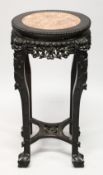 A CHINESE CARVED HARDWOOD AND MARBLE INSET VASE STAND, with pierced and carved frieze depicting