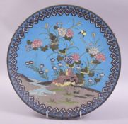 A JAPANESE CLOISONNE CIRCULAR DISH, decorated with birds and native flora, 30.5cm diameter.
