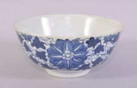 A SMALL CHINESE BLUE AND WHITE PORCELAIN BOWL, painted with stylised flower heads and scrolling