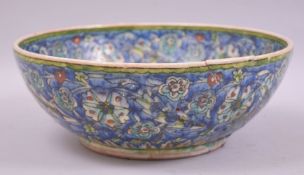 A LARGE PALESTINIAN JERUSALEM GLAZED POTTERY BOWL, 27cm diameter (af).