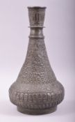 AN ISLAMIC TINNED COPPER HUQQA BASE, with embossed floral decoration, 30cm high.