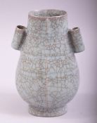 A SMALL CHINESE SONG STYLE TWIN HANDLE CELADON VASE, 12.5cm high.