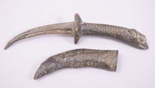 A SMALL CHINESE BRONZE DAGGER AND SCABBARD, with zoomorphic hilt, dagger 23cm long.