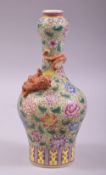 A SMALL CHINESE FAMILLE VERTE PORCELAIN BOTTLE VASE, with a coral red and gilt chilong curled around