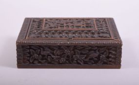 A 19TH CENTURY INDIAN CARVED WOODEN SPICE BOX, 13.5cm x 11cm.
