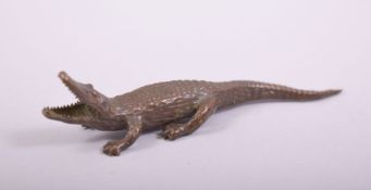 A SMALL JAPANESE BRONZE MODEL OF AN ALLIGATOR, 8.5cm long.
