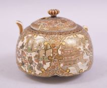 A JAPANESE SATSUMA PORCELAIN BOX AND COVER, decorated with panels of figures, landscapes, temples