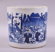 AN EARLY 20TH CENTURY CHINESE BLUE AND WHITE PORCELAIN BRUSH POT, painted with various figures in