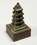 A SMALL CHINESE BRONZE PAGODA SEAL 3ins high.