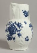 AN 18TH CENTURY CAUGHLEY MASK JUG with cabbage leaf moulding decorated with floral bouquets