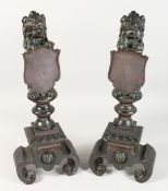 A SUPERB PAIR OF 19TH CENTURY BRONZE ANDIRONS with lion holding shields on curving feet.