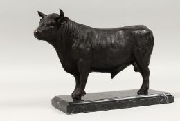 A BRONZE MULE on a marble base.