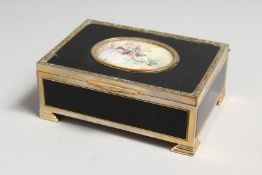 A GOOD GILT JEWELLERY BOX the lid inset with an oval of young lovers. Signed T GREUZE.