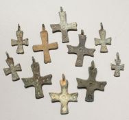 TWO SMALL ROMAN CAST IRON CROSSES.