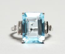 A LARGE, BLUE, TOPAZ AND DIAMOND 18CT GOLD RING.