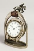 AN EDWARDIAN JOCKEY CLOCK. 10ins high.