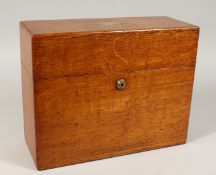 A VICTORIAN OAK DECANTER BOX with three cut glass square decanters all with silver labels. 13ins