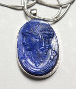 A LAPIS PENDENT on a 14ct white gold chain.