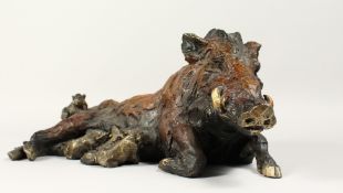 A BRONZE WART HOG with young, 18ins long.