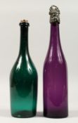 TWO EARLY COLOURED GLASS BOTTLE DECANTERS and stoppers. 12ins high.