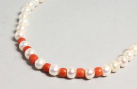 A STRING OF PEARL AND CORAL NECKLACE.