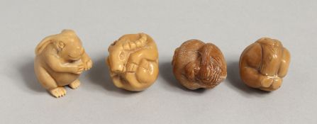 FOUR SMALL CARVED BONE NETSUKES of animals