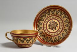 A RUSSIAN GILDED CUP AND SAUCER.