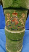 A 19TH / EARLY 20TH CENTURY GREEN PAINTED CANVAS SHELL CARRIER, with leather handle and applied coat