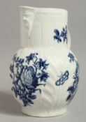 AN 18TH CENTURY WORCESTER MASK JUG with cabbage leaf moulding decorated with the Natural Sprays