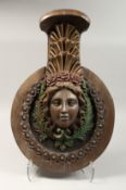 AN 18TH - 19TH CENTURY CARVED WOOD CIRCULAR PLAQUE, a classical female head with maritine rope