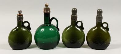 FOUR EARLY COLOURED GLASS FLAGONS / DECANTERS and stoppers. 7.5ins & 8.5ins tall.