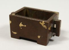A SMALL RECTANGULAR BRONZE GOLD SPLASH CENSER with handles, impressed mark.