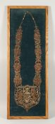 A FRAMED INDIAN GILT THREAD CHAIN OF OFFICE 'PBORGEETPOTRIA'. 3.5ins x 11.5ins.
