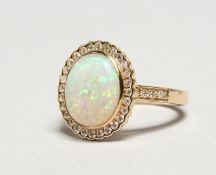 AN 18CT YELLOW GOLD OPAL AND DIAMOND RING