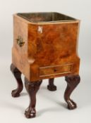 A GOOD SQUARE SHAPED JARDINIERE with tin liner and single drawer on cabriole legs with claw ball