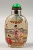 A CHINESE EROTIC REVERSE PAINTED SNUFF BOTTLE. 3.5ins high.
